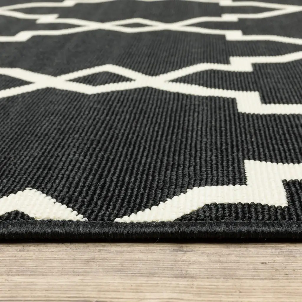 2' X 4' Black and Ivory Indoor Outdoor Area Rug - Image 3