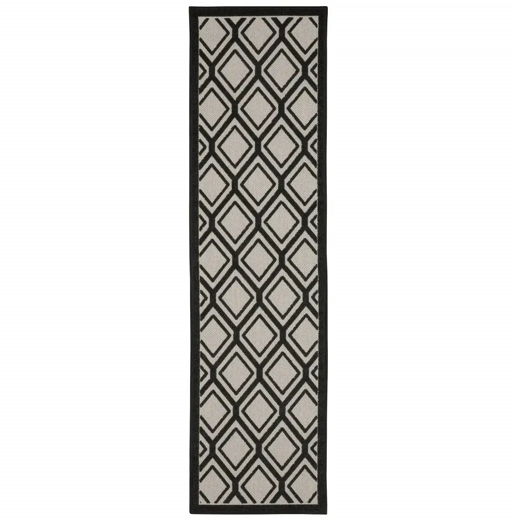 2' X 7' Beige and Black Geometric Stain Resistant Indoor Outdoor Area Rug