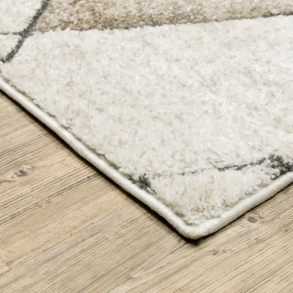 5' X 8' Beige Grey Tan And Brown Geometric Power Loom Stain Resistant Area Rug - Image 4