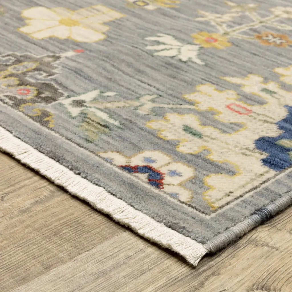5' X 8' Grey Ivory Gold Salmon Red Blue And Green Oriental Power Loom Stain Resistant Area Rug With Fringe - Image 3