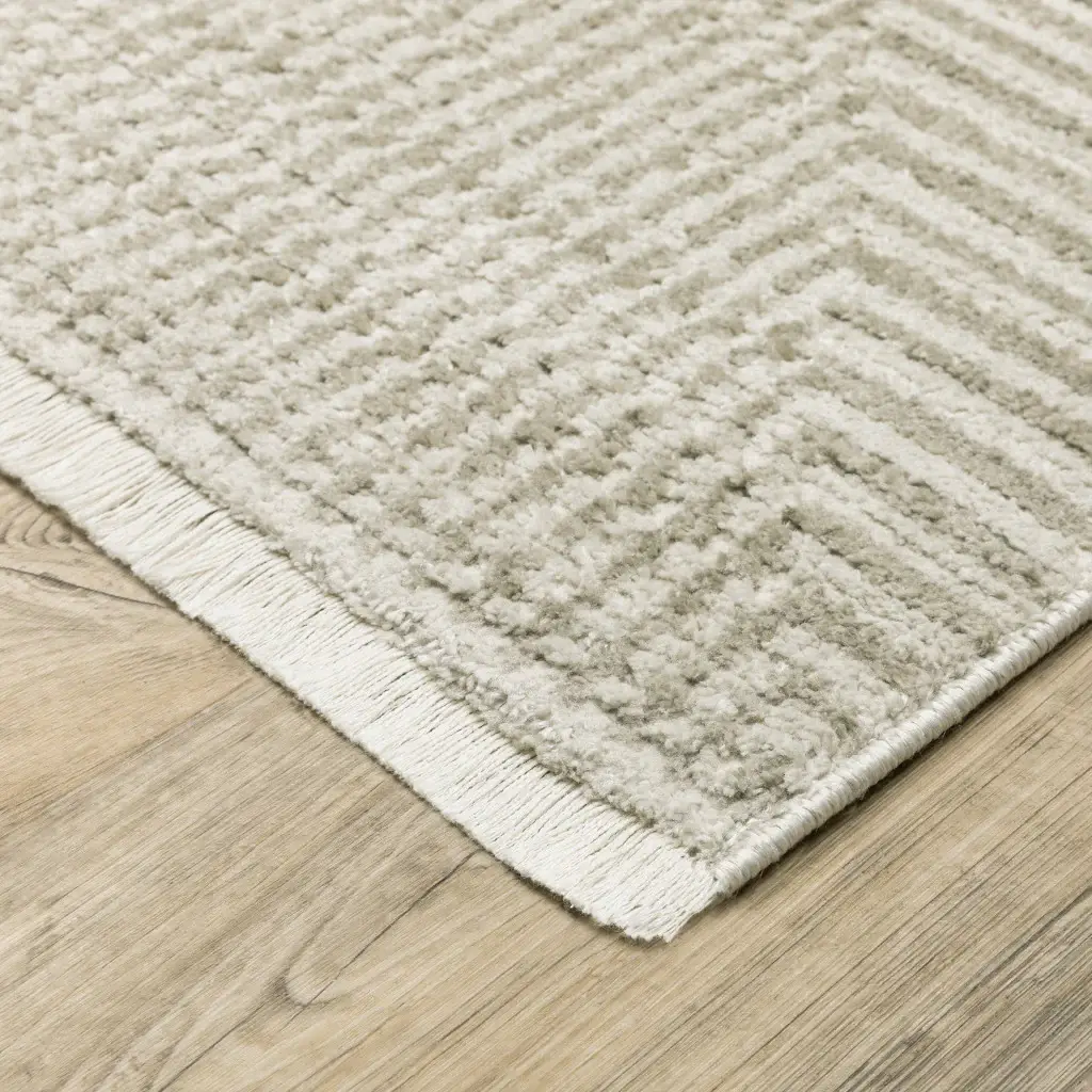 5' X 8' Ivory Beige Taupe And Tan Geometric Power Loom Stain Resistant Area Rug With Fringe - Image 4