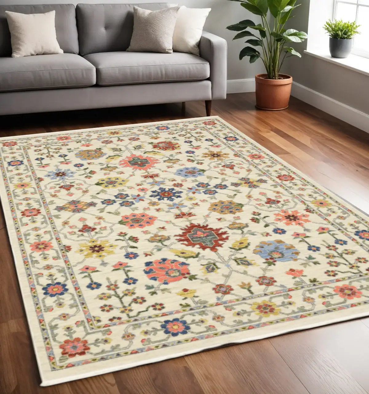 5' X 8' Ivory Salmon Pink Gold Blues Grey Rust And Green Oriental Power Loom Stain Resistant Area Rug With Fringe