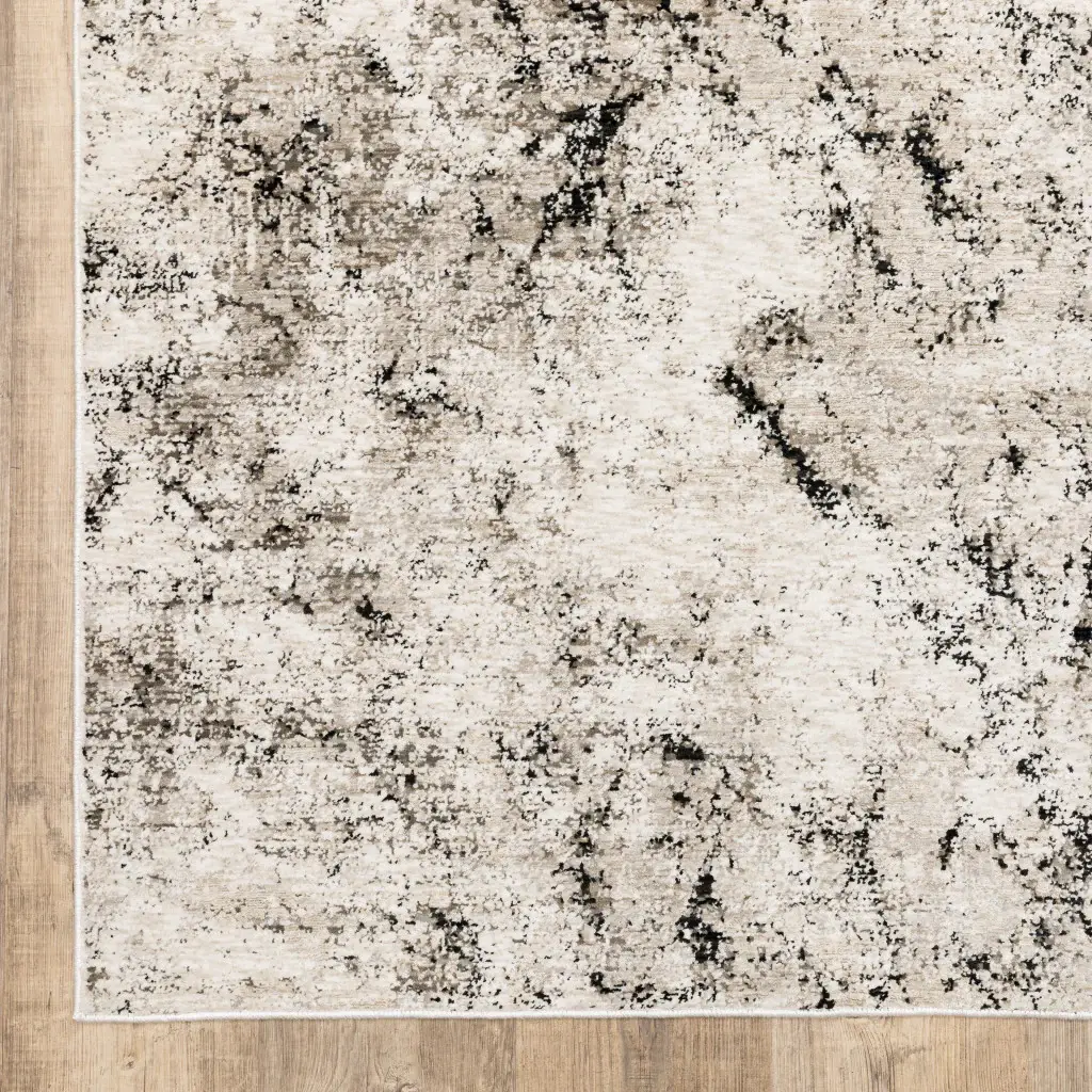 6' X 9' Ivory Grey Black Beige And Tan Abstract Power Loom Stain Resistant Area Rug - Image 4