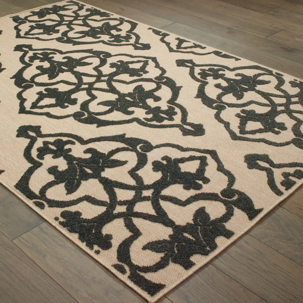7' X 10' Beige and Black Oriental Stain Resistant Indoor Outdoor Area Rug - Image 4