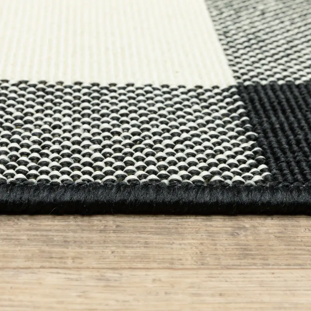8' X 11' Black and Ivory Indoor Outdoor Area Rug - Image 4