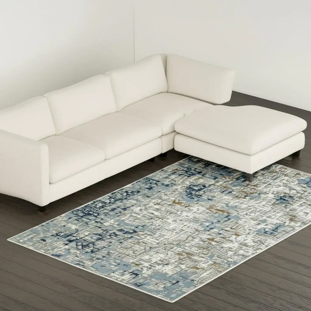 8' X 11' Blue Ivory Grey Brown Beige And Light Blue Abstract Power Loom Stain Resistant Area Rug