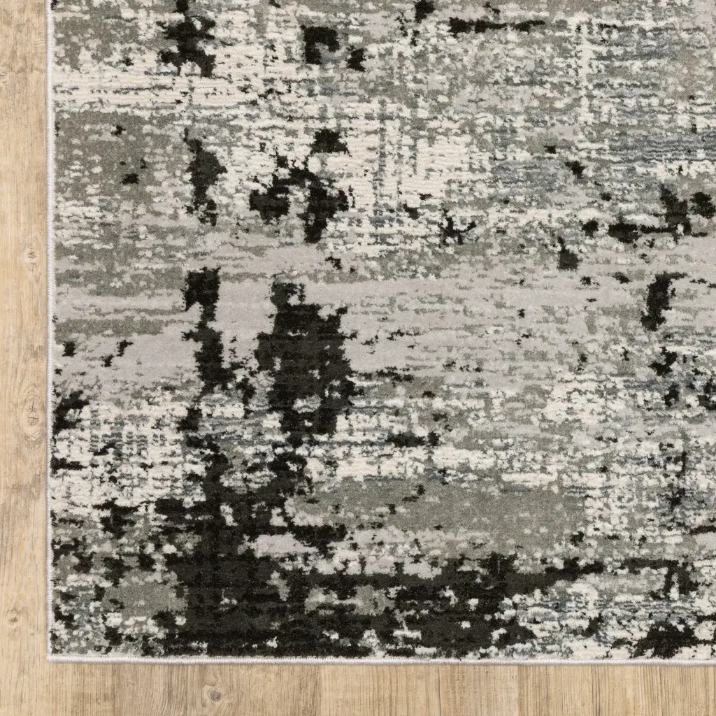 8' X 11' Grey Charcoal Black And Ivory Abstract Power Loom Stain Resistant Area Rug - Image 3
