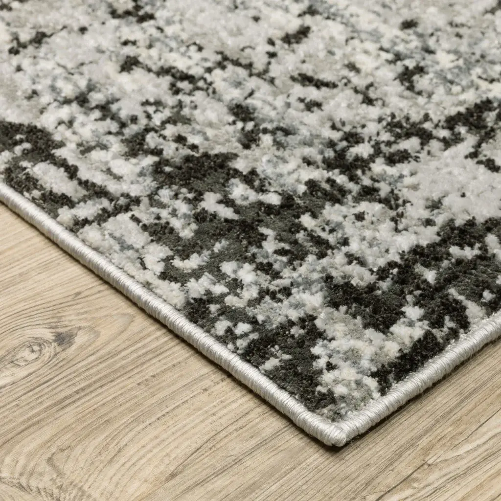 8' X 11' Grey Charcoal Black And Ivory Abstract Power Loom Stain Resistant Area Rug - Image 4