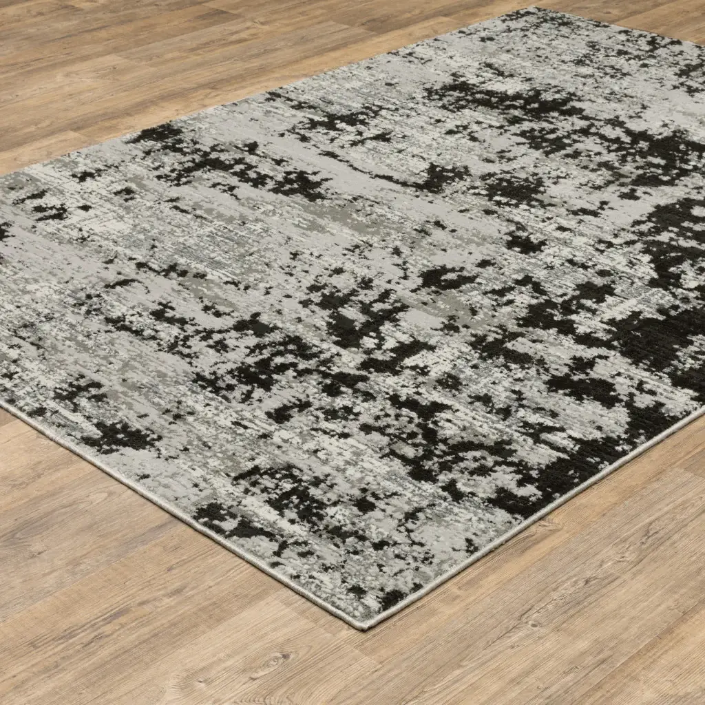 8' X 11' Grey Charcoal Black And Ivory Abstract Power Loom Stain Resistant Area Rug - Image 5