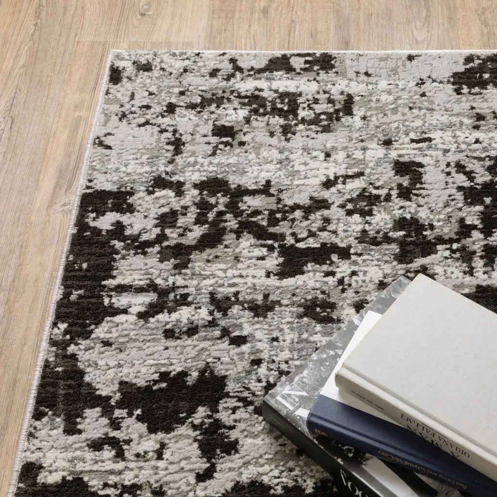 8' X 11' Grey Charcoal Black And Ivory Abstract Power Loom Stain Resistant Area Rug - Image 6