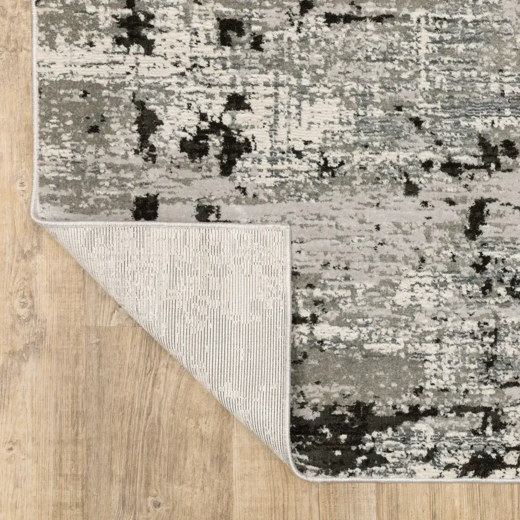 8' X 11' Grey Charcoal Black And Ivory Abstract Power Loom Stain Resistant Area Rug - Image 7